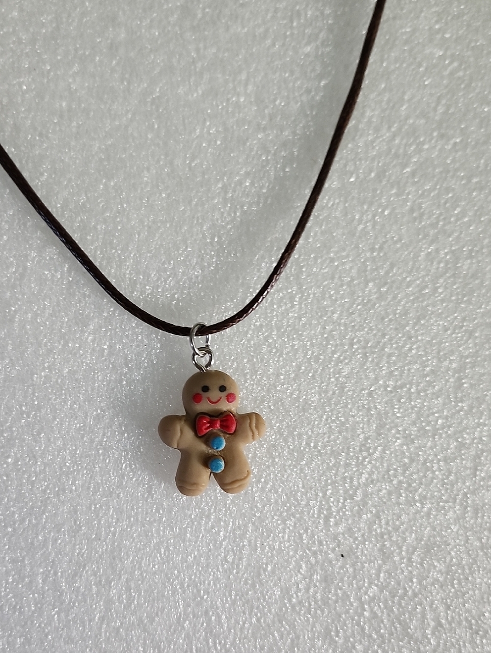 Hand Crafted Brown Gingerbread Man Necklace with Red and Blue Accents